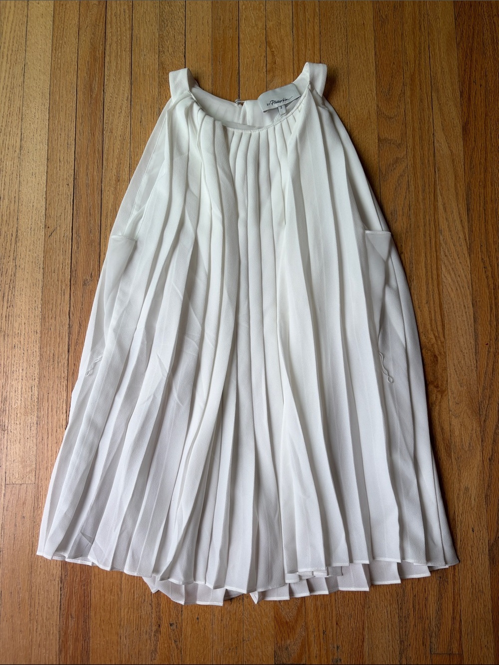 Pleated White Sleeveless Blouse